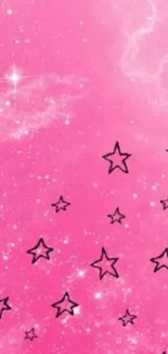 Pink starry galaxy wallpaper with whimsical stars.