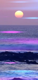 Pink sunset over the ocean with purple and blue accents on the waves.