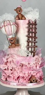 Pink cake with teddy bears and artistic flair.