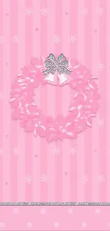 Pink wallpaper with a wreath and silver bow on stripes.