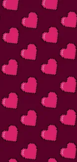 Pixelated pink hearts on a maroon background.