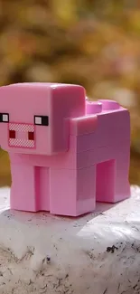 Pixelated pink pig block on a textured surface.