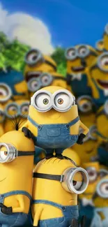 Cheerful cartoon minions gather in colorful group pose for mobile wallpaper.