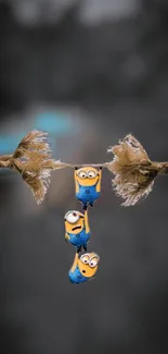 Cartoon characters hanging on a rope in a playful scene.