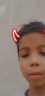 Playful child with digital devil horns in beige background.