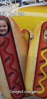 Children wearing hotdog suits for a fun photo.