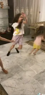 Children play joyfully indoors on marble flooring.