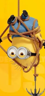 Minion tangled in ropes on yellow background, from animated film.