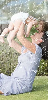 Mother lifts baby with raindrop effect.