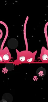 Playful pink cartoon cats on a black background.