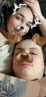 Couple with Snapchat dog filter posing playfully.