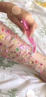 Colorful stickers on a leg in a playful wallpaper design.