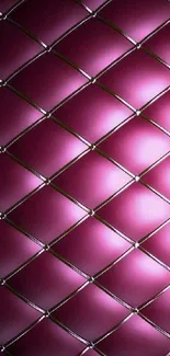 Plush pink geometric wallpaper with a quilted diamond pattern.