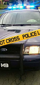 Police car with flashing lights and 'Do Not Cross' tape.