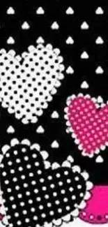 Black background with polka dot hearts in white and pink.