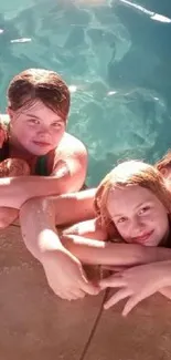 Group of friends smiling by the sunny poolside on a summer day.