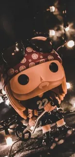 Pop vinyl figure with glowing lights and dark background wallpaper.