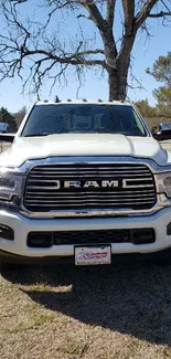 Front view of a RAM truck on a sunny day, showcasing its robust design.