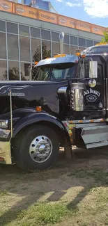 A powerful truck parked outside a Harley Davidson building.