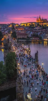 Aerial view of Prague at sunset with a vibrant sky and historic architecture.