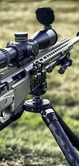 Close-up of a sniper rifle on a tripod in a grassy field.