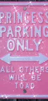 Sparkling pink sign with 'Princess Parking Only' text on a wood background.