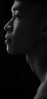 Black and white silhouette portrait of a person's profile.