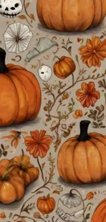 Orange pumpkins and autumn flowers on a decorative background.