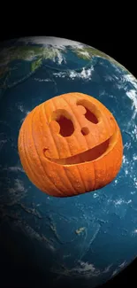 Floating carved pumpkin with Earth backdrop.