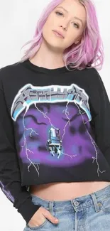 Person with pink hair in rock-themed purple shirt.