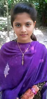 Young girl in purple attire standing in a serene garden.