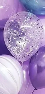 Cluster of purple and blue balloons for a festive mobile wallpaper.