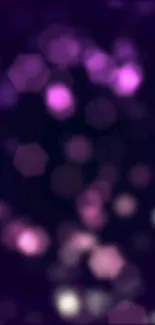 Purple bokeh wallpaper with hexagonal lights.