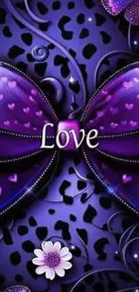 Purple bow with hearts and love text.