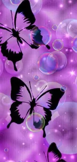 Black silhouettes of butterflies with bubbles on a purple background wallpaper.