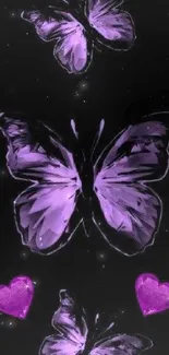 Purple butterflies and hearts on black background wallpaper.