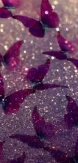 Purple butterflies shimmer on glittery surface.