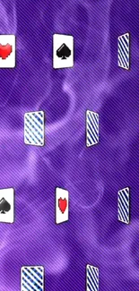 Purple wallpaper with floating playing cards and smoke design.