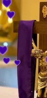 Wooden cross with purple cloth and heart accents.