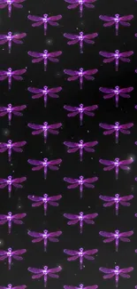 Purple dragonfly pattern on dark wallpaper.