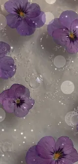 Purple flowers with water droplets on a mobile wallpaper.