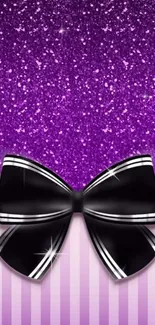 Purple glitter background with black bow.