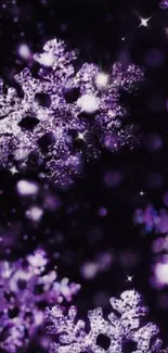 Beautiful purple glitter snowflake pattern on a dark background wallpaper.