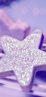 Glittery purple star on a lilac bokeh background.