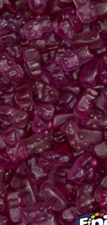 Purple gummy bear wallpaper with vibrant candy pattern.