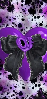 Purple heart with black lace bow on artistic background.