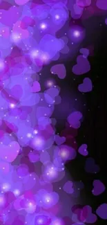 Purple bokeh wallpaper with heart shapes.