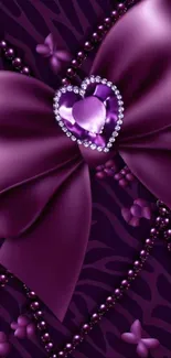 Purple bow with heart gem and floral accents.