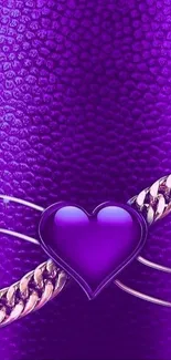 Purple heart with gold chain on textured background