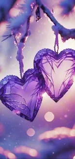 Purple crystal hearts hanging in winter scenery.